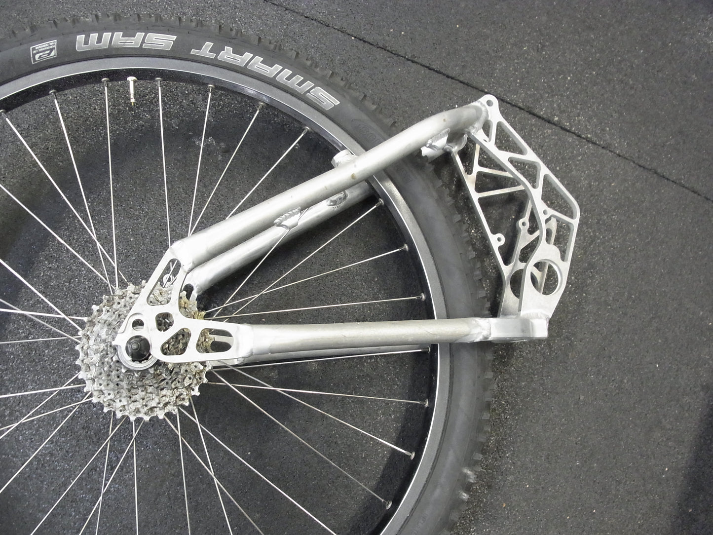 Porsche FS swingarm 26 inch raw, brake mount close-up, without powder coating