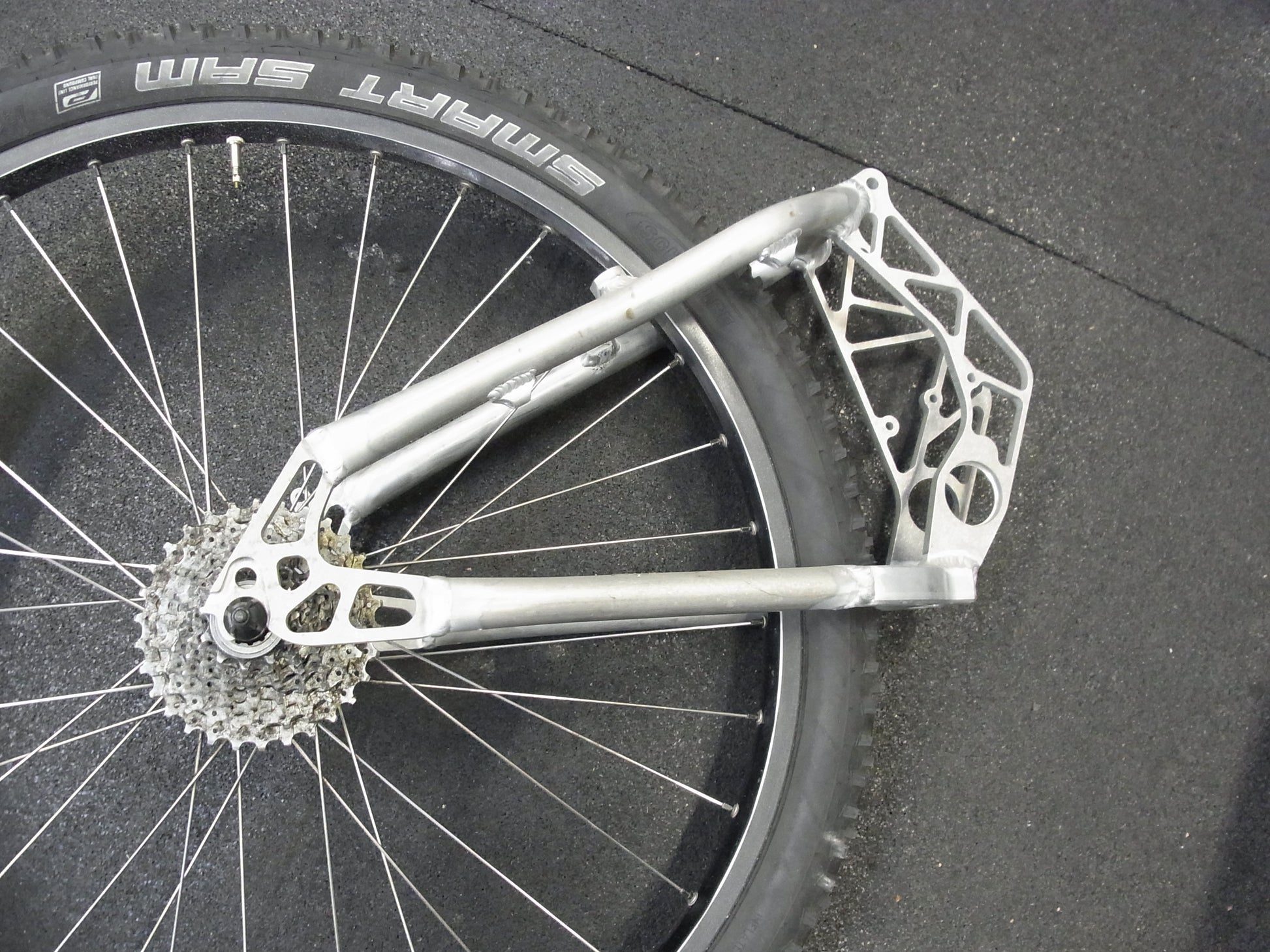 Porsche FS swingarm 26 inch raw, brake mount close-up, without powder coating