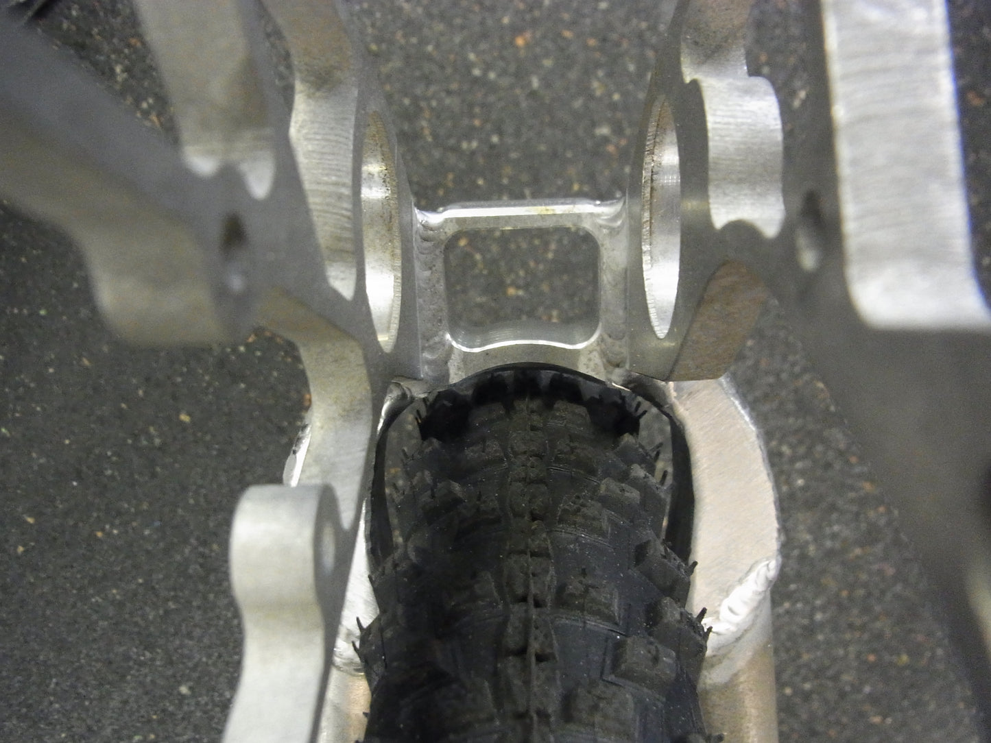 Porsche FS swingarm 27.5 inch, raw, tire clearance detail, unfinished